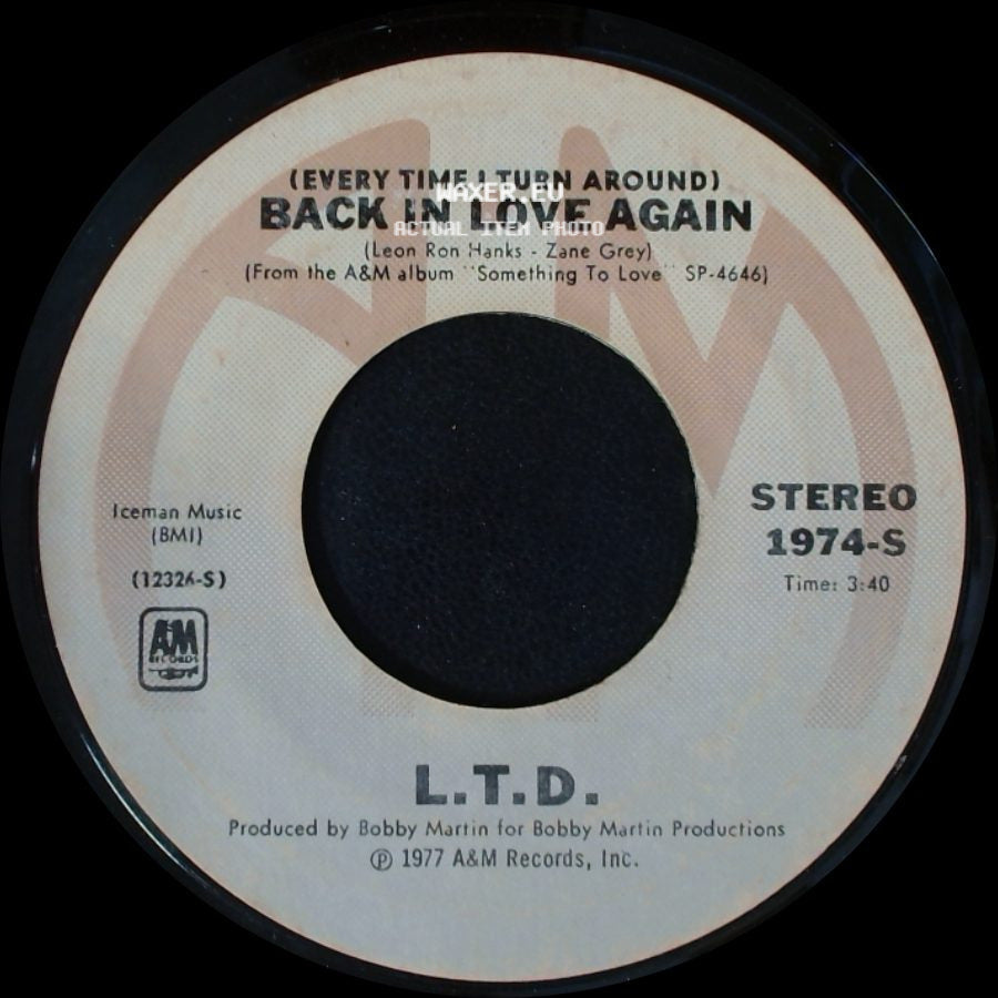 L.T.D. - (Every Time I Turn Around) Back In Love Again / Material Things side A