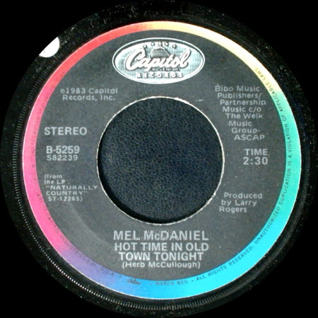 Mel Mcdaniel - Hot Time In Old Town Tonight / Some Folks Are Dying To Live Like This side A